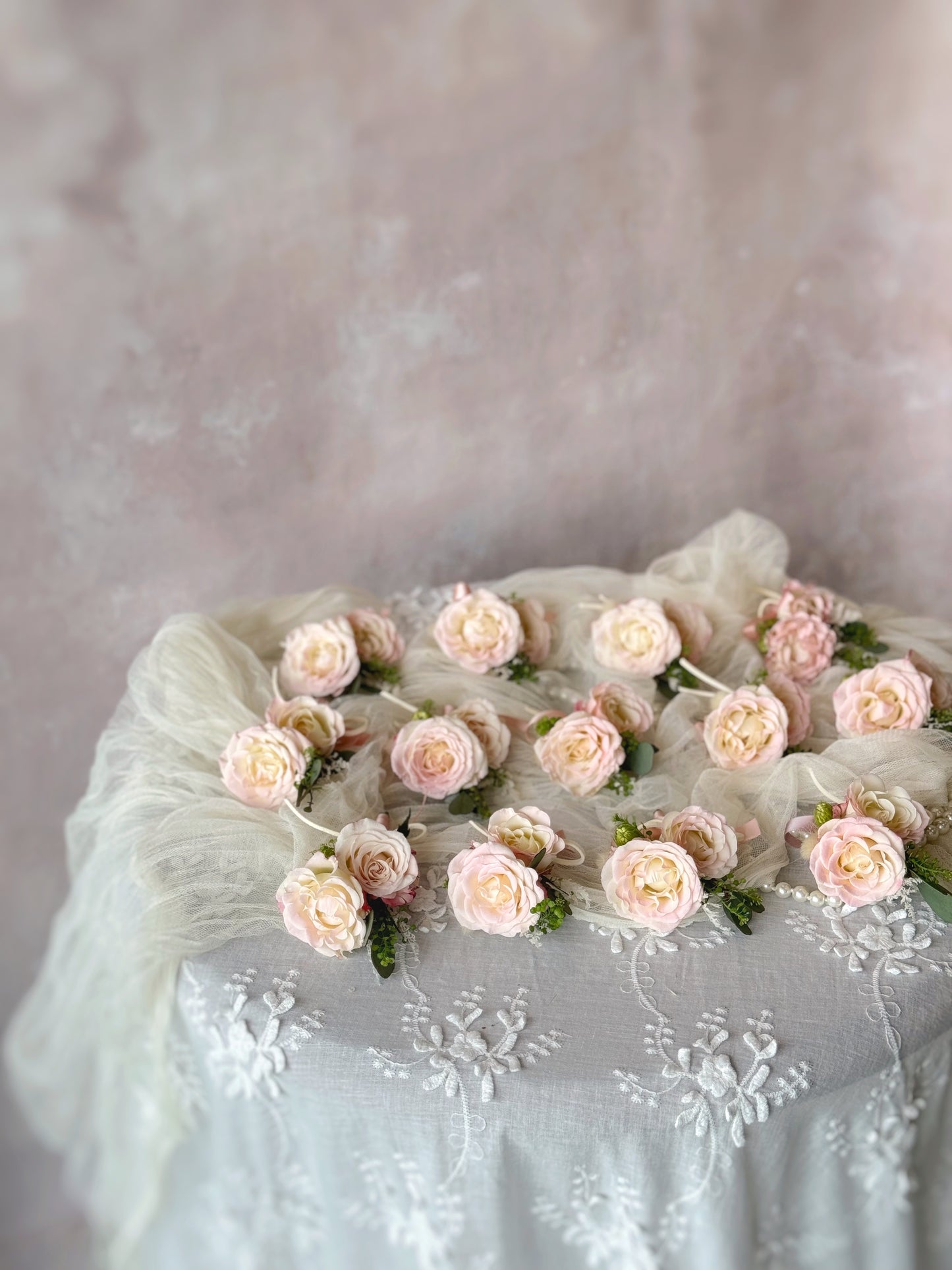 Collection of 'Adoring' boutonnieres arranged together, ideal for weddings and formal