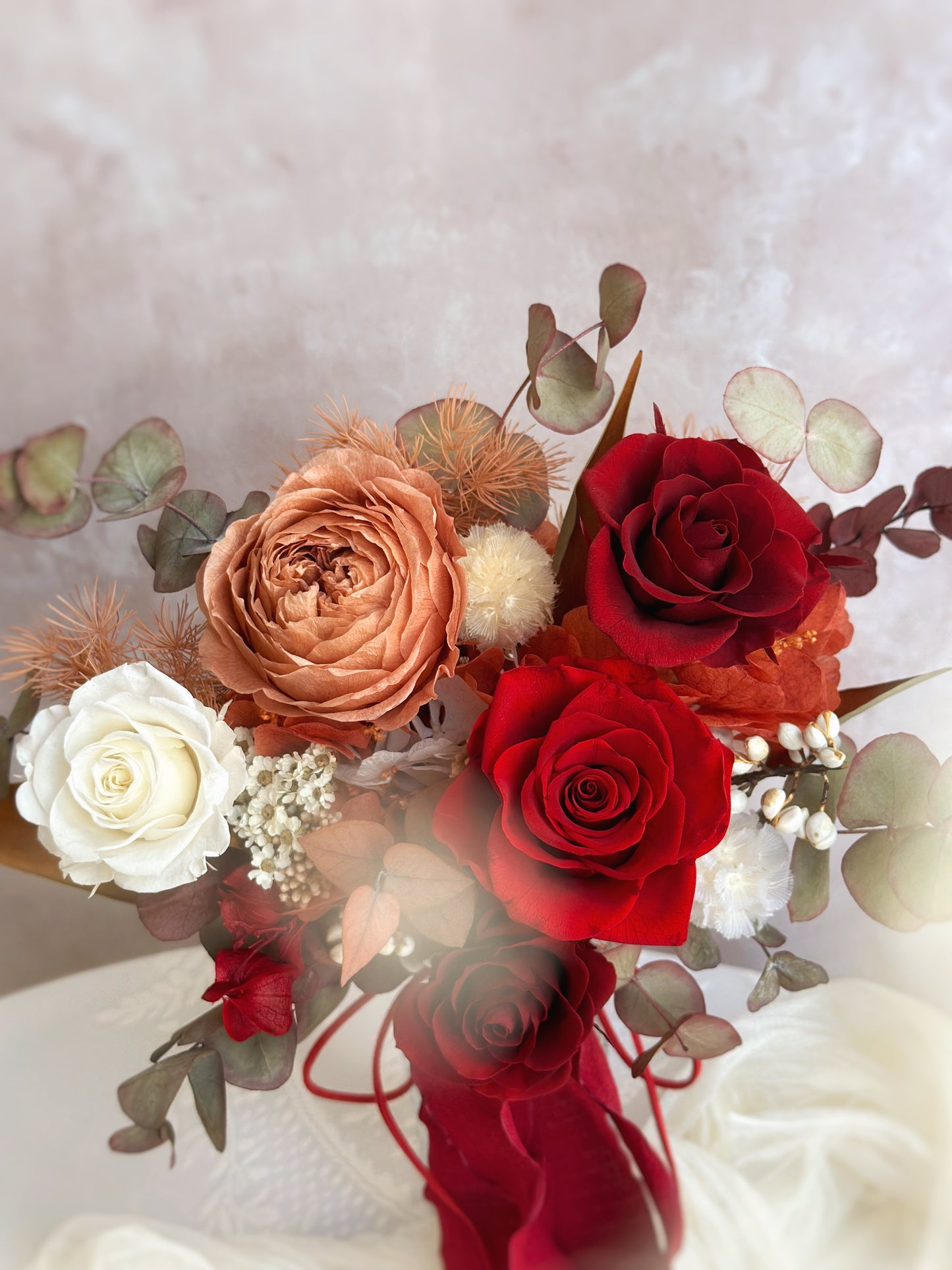 Close up view of preserved Austin roses and roses bouquet