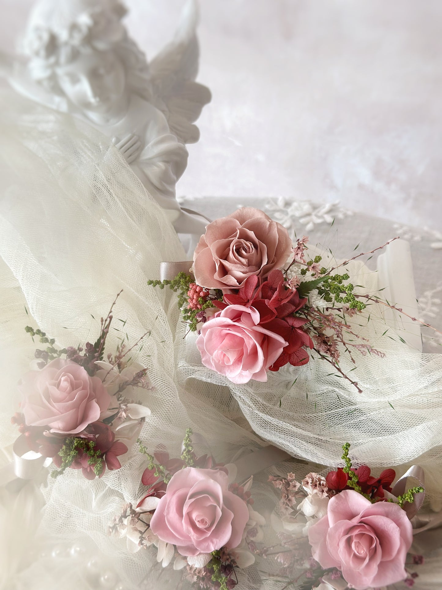 Mei Hwa preserved rose boutonniere comparison: single rose vs. double rose design, featuring soft pink hues and delicate dried foliage for an elegant wedding accessory.