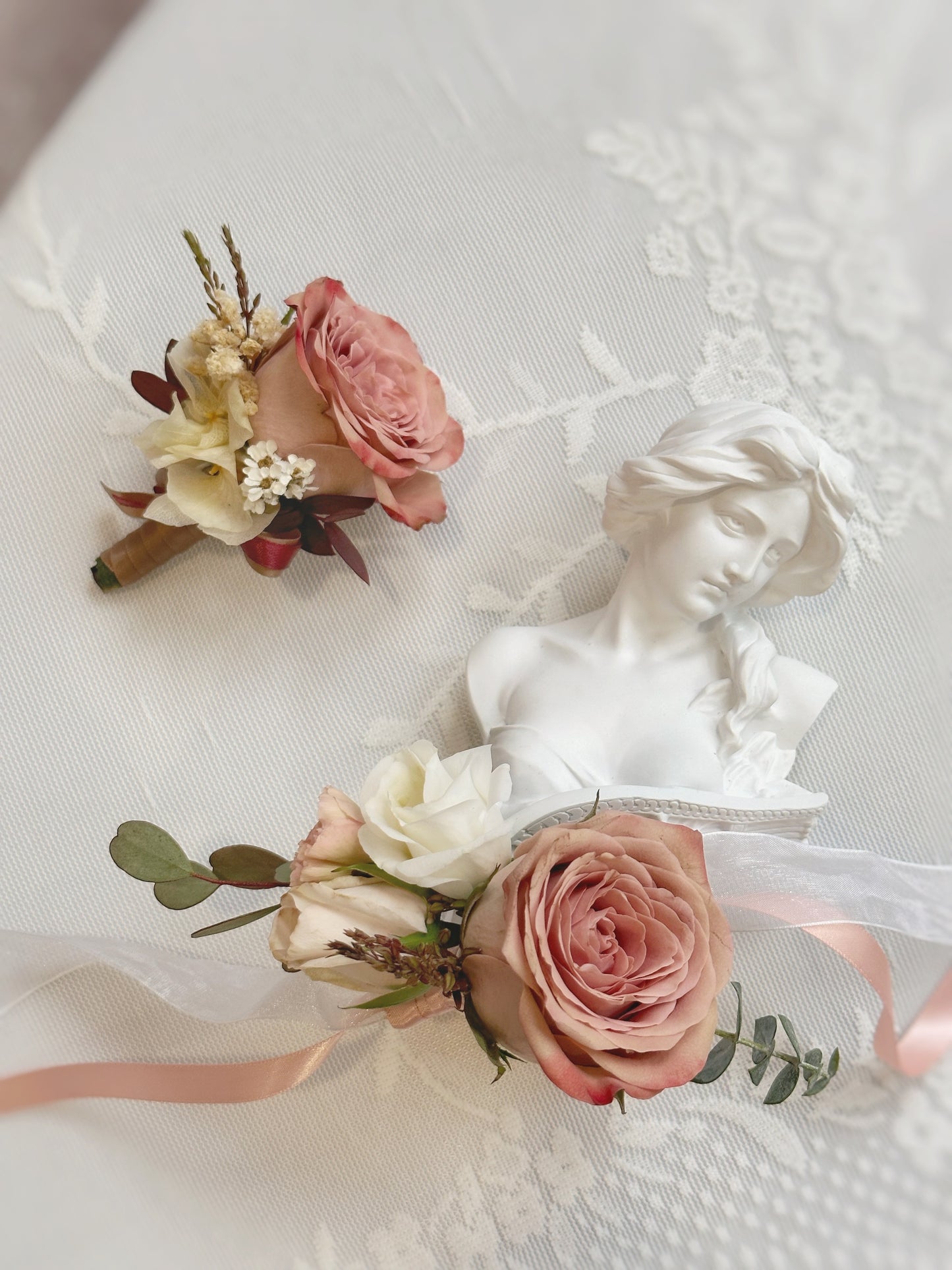 close up view of 'rose douce' fresh flowers boutonniere and wrist corsage