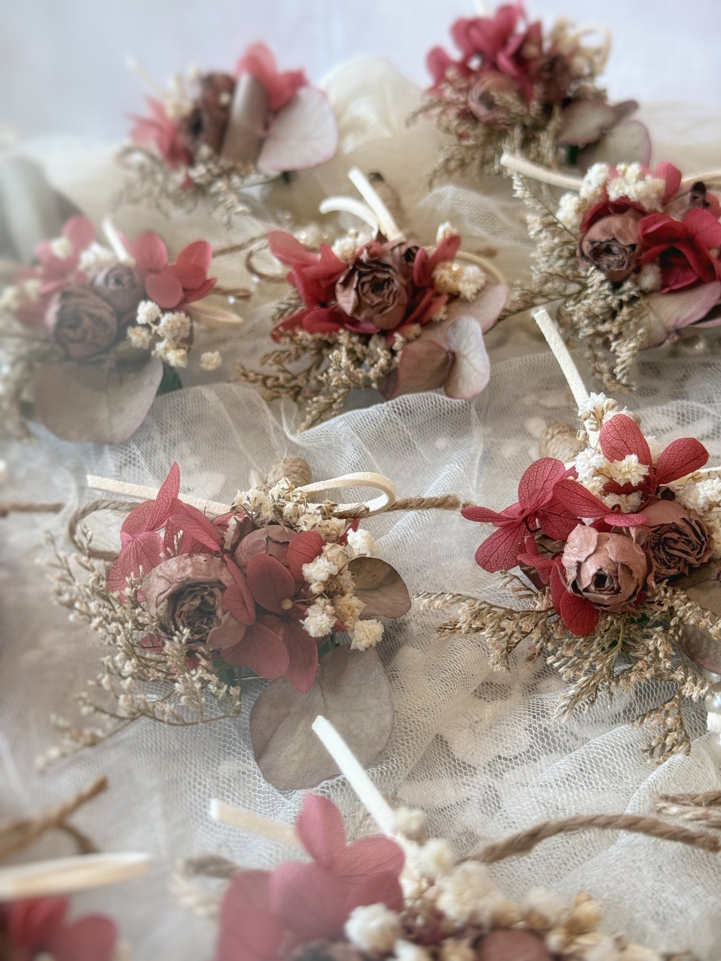 Rustique Rose tinted preserved and dried flowers boutonniere dried roses close up view
