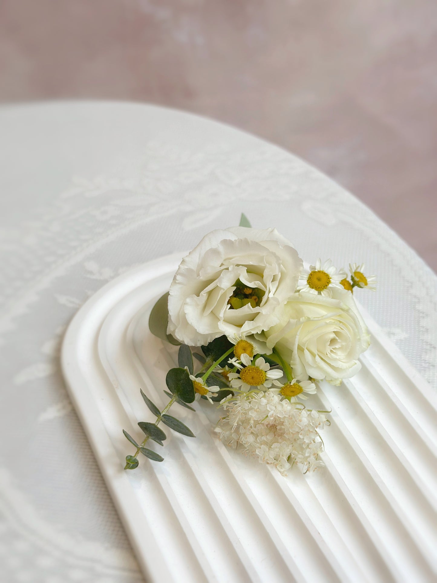top view of 'lace' fresh flowers boutonniere