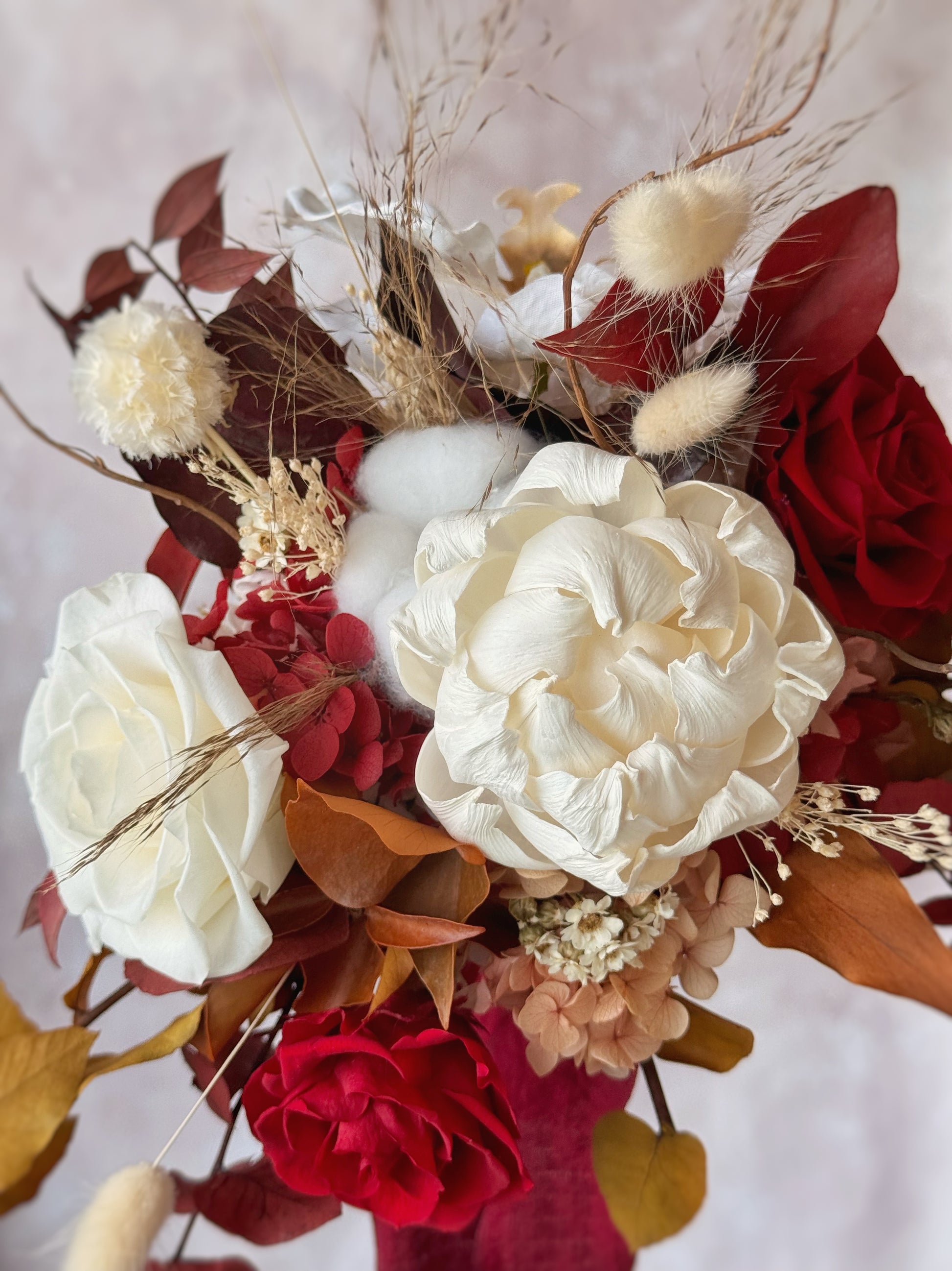 Amber freeform preserved flowers cascading bouquet close up view