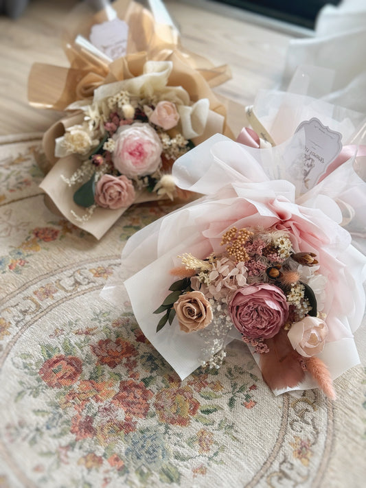 Preserved Austin roses bouquets on a vintage carpet 