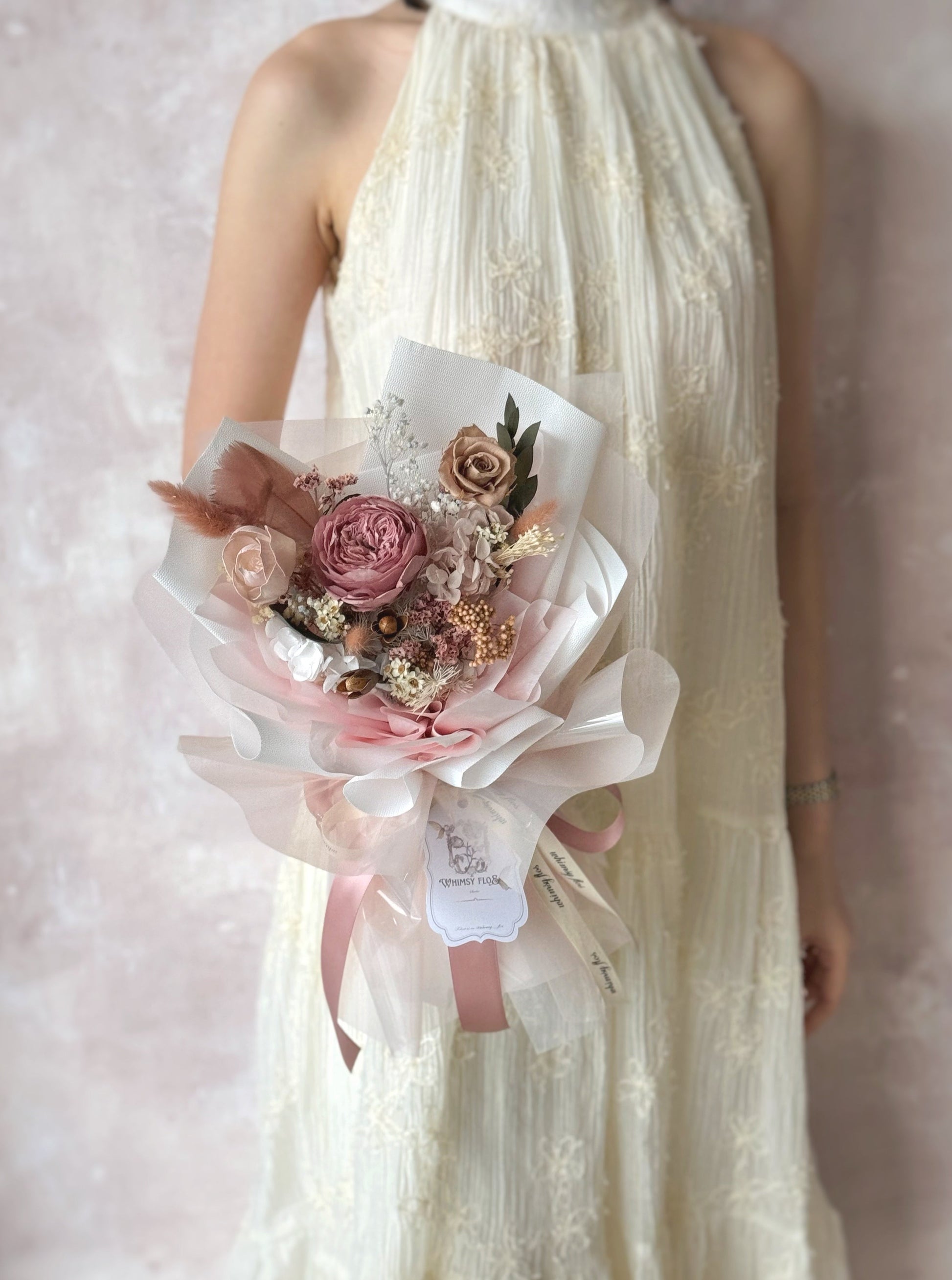 model holding a standard size preserved Austin roses bouquet 