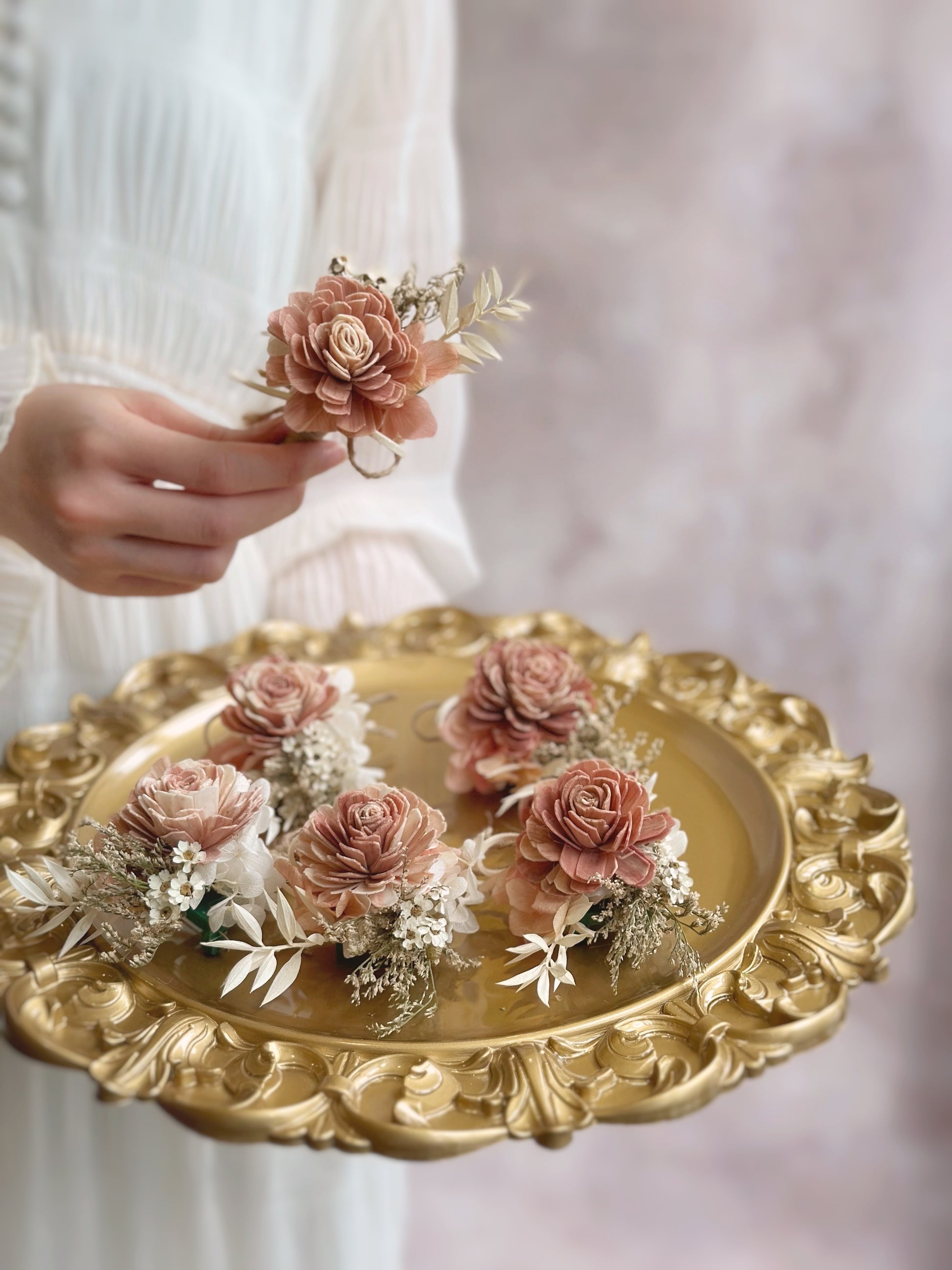 A handcrafted Sola wood flower boutonniere with tropical and rustic elements, perfect for a Balinese or boho-themed wedding.