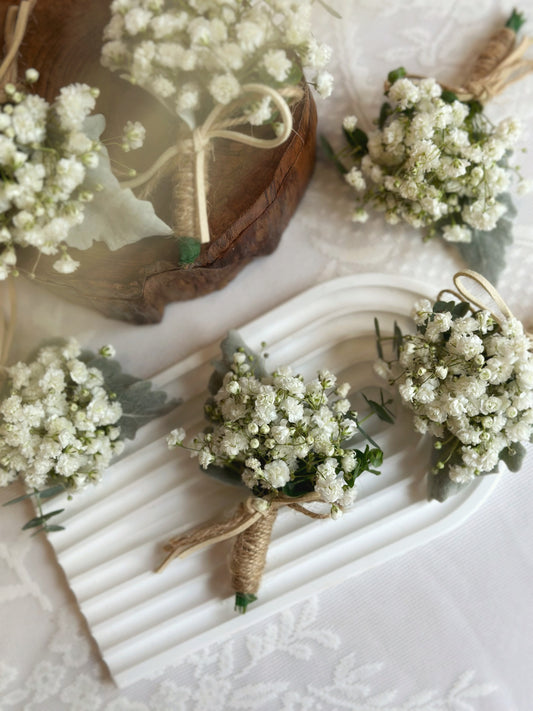 front view of dainty white fresh baby breath corsage 