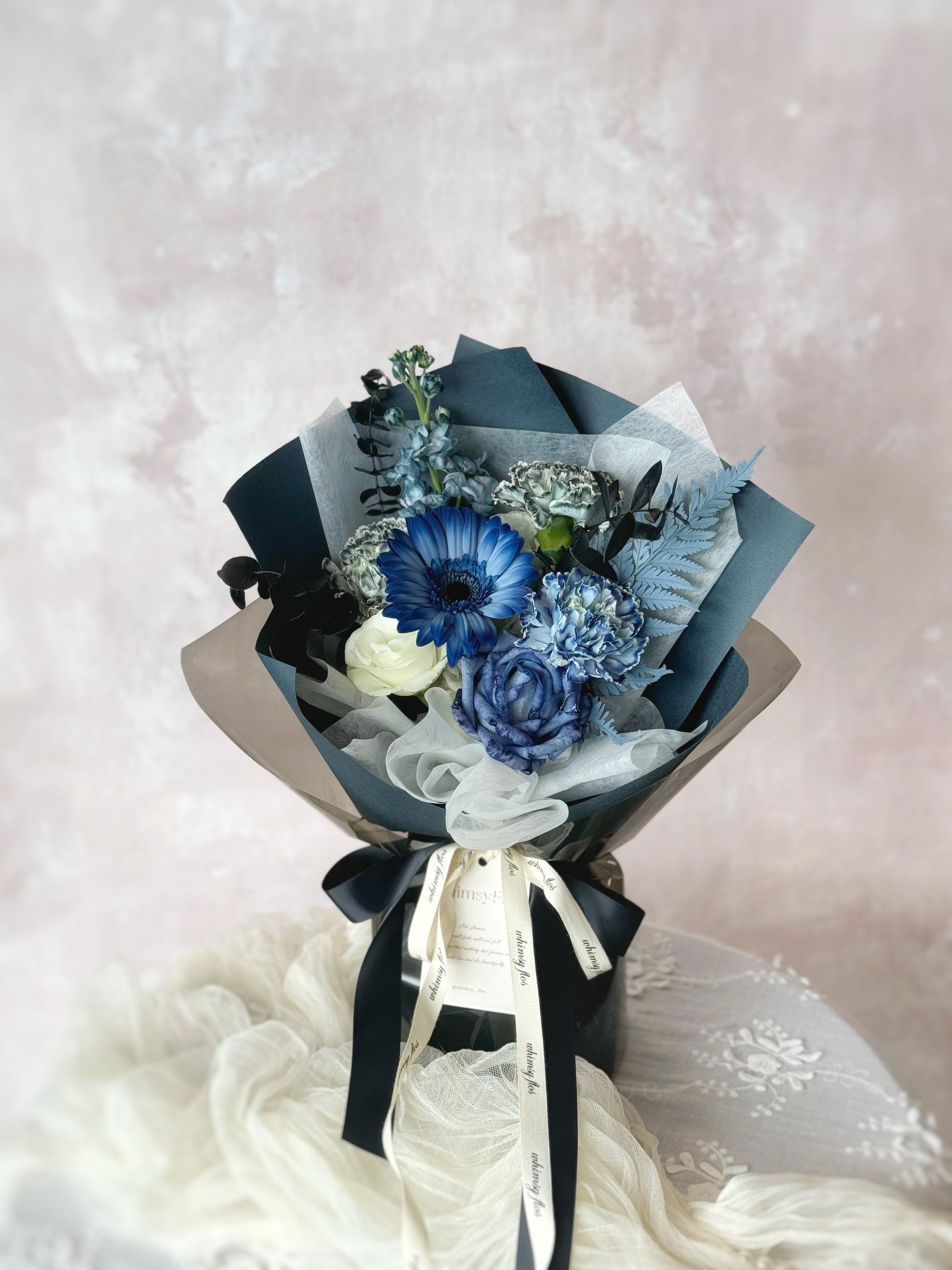 Deep diver dyed fresh_flowers luxe size_handtied_bouquet in deep blue color theme on the table 