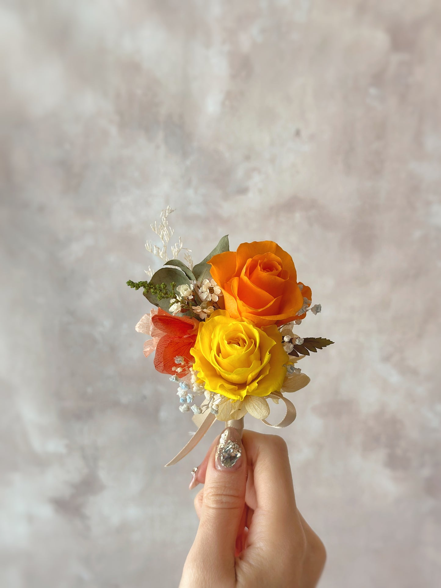Close up view of double tansy preserved flowers boutonnieres