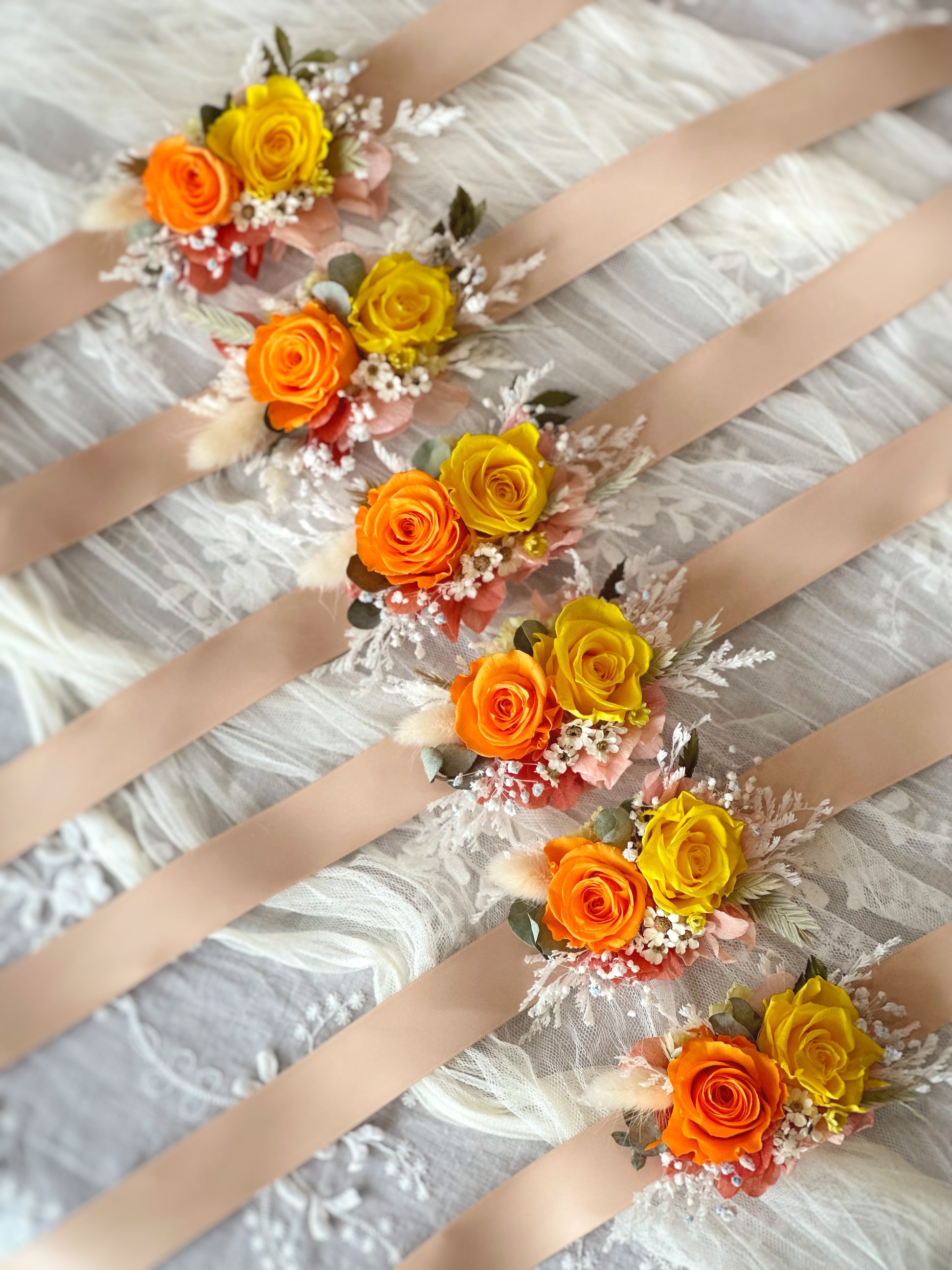 top view of double tansy preserved flowers wrist corsage lying elegantly on the table