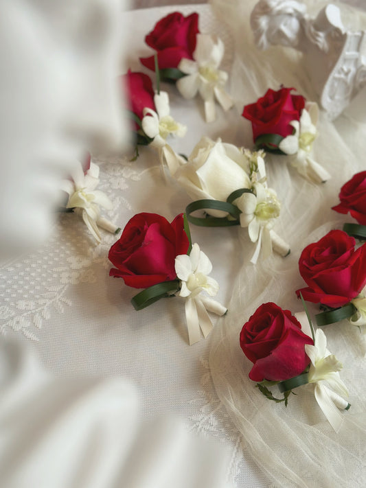 side view of Genevieve fresh rose corsage, red and white rose