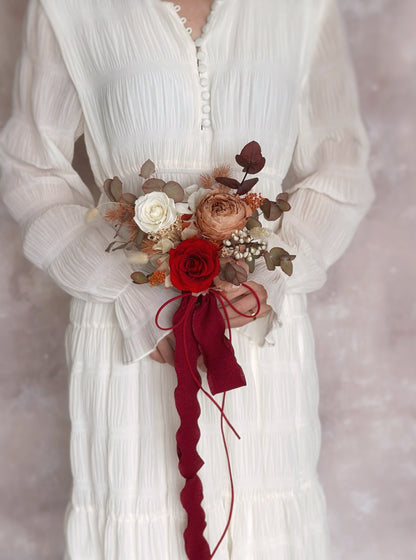 Holding a small (adorable size) preserved flowers bridal bouquet in autumnal theme 