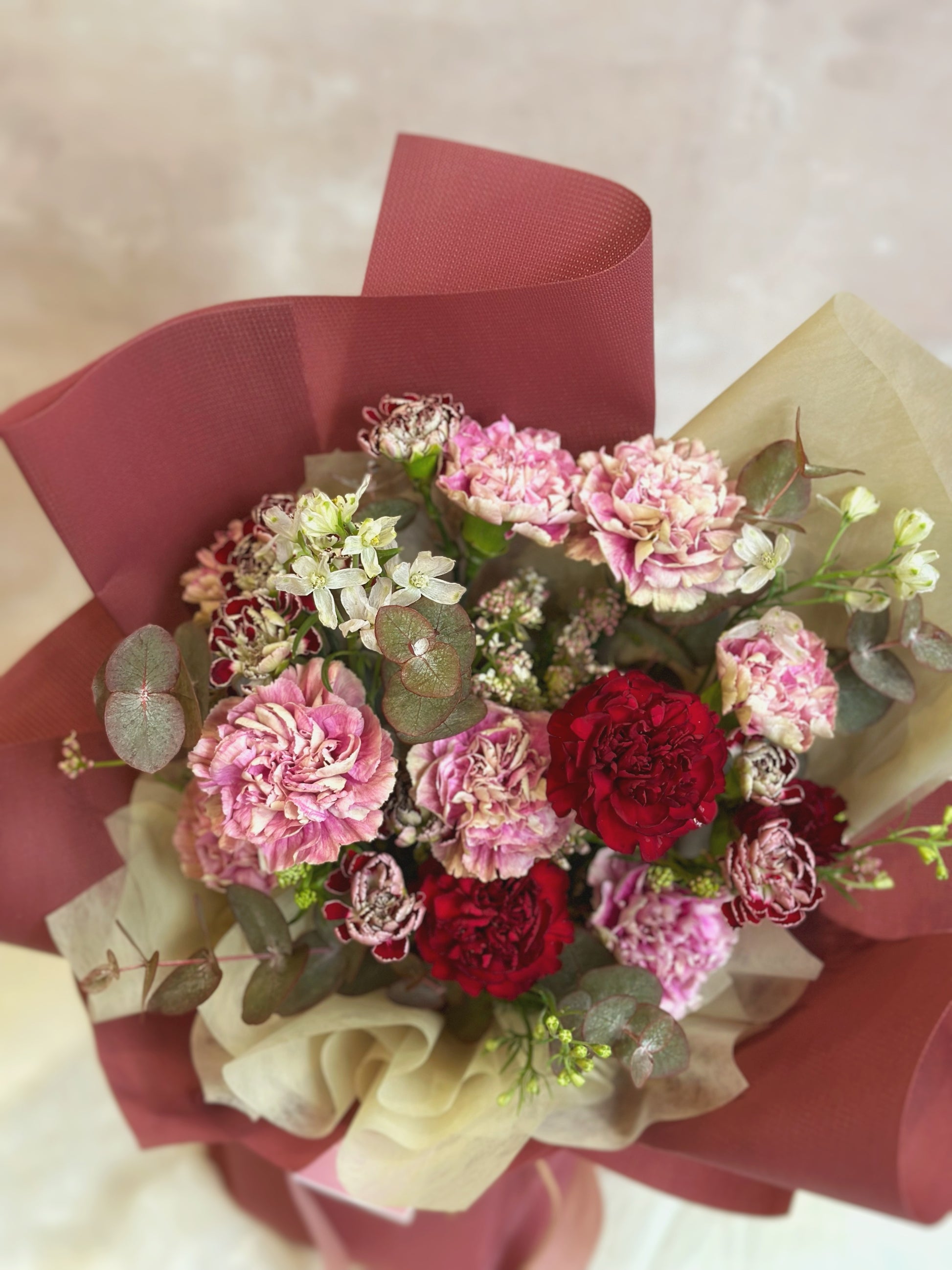 Close up view of vintage hues carnations bouquet
