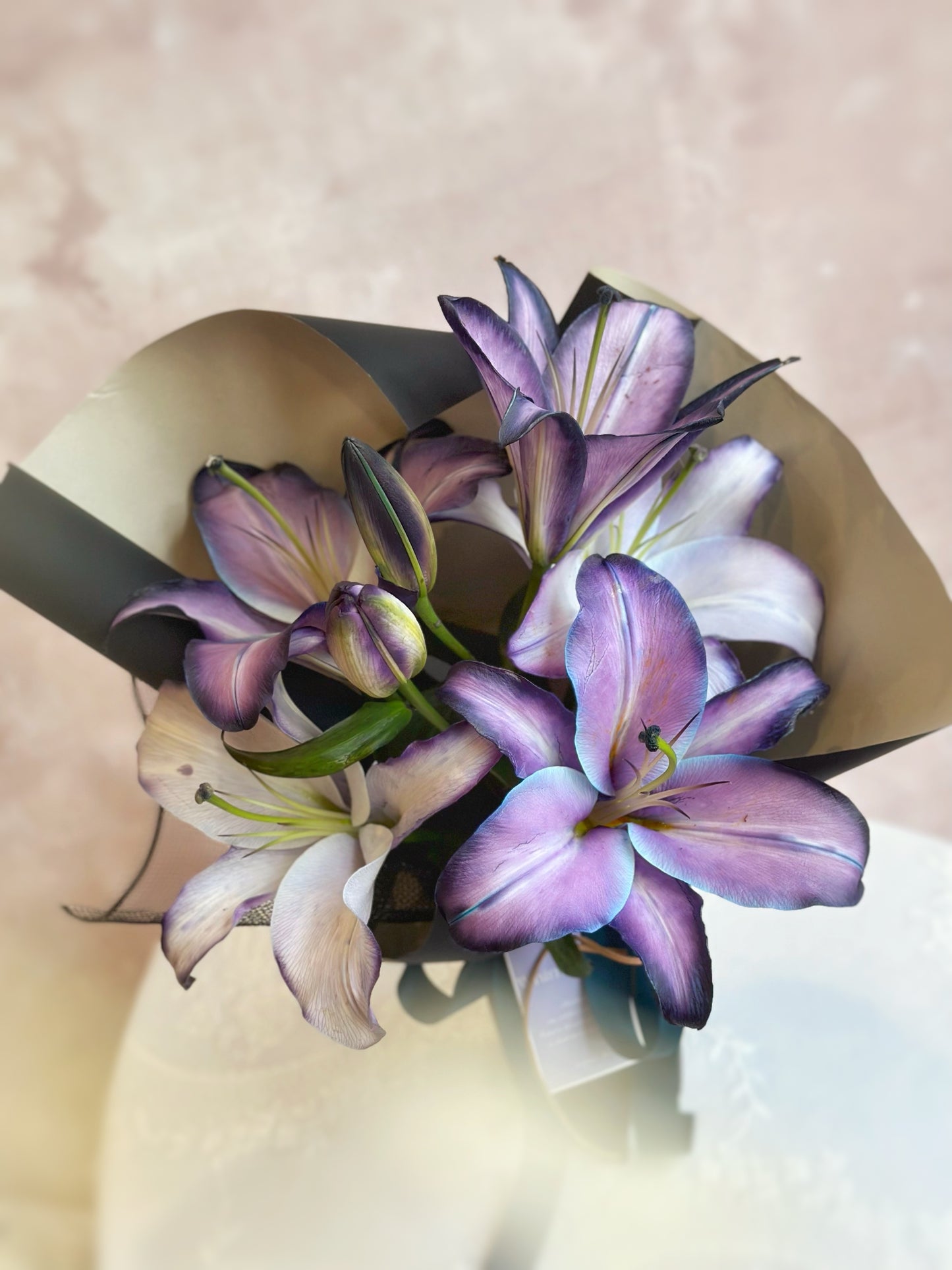 Stem dyed lilies in amethyst tone close up