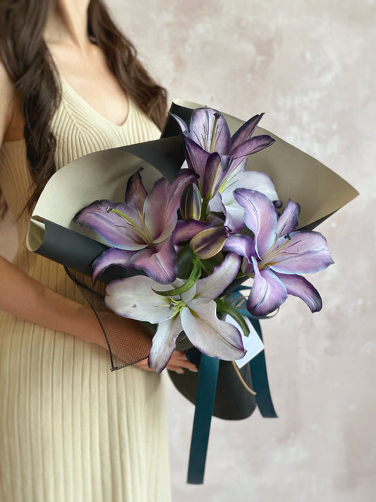 Stem dyed lilies bouquet in amethyst tone