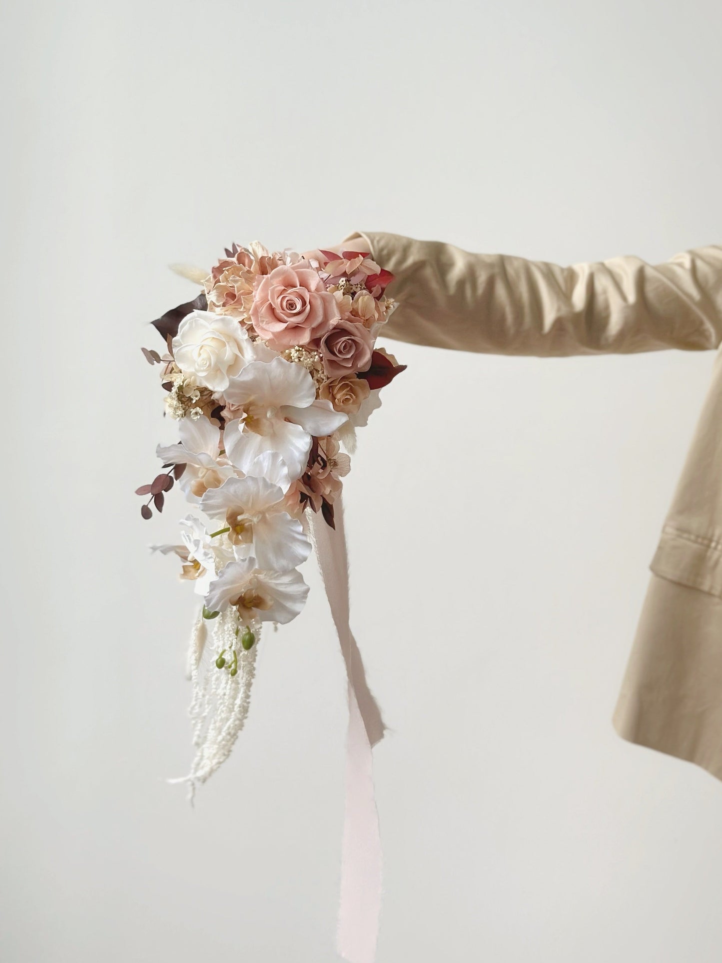 Preserved roses teardrop bridal bouquet, earthy tone, front view