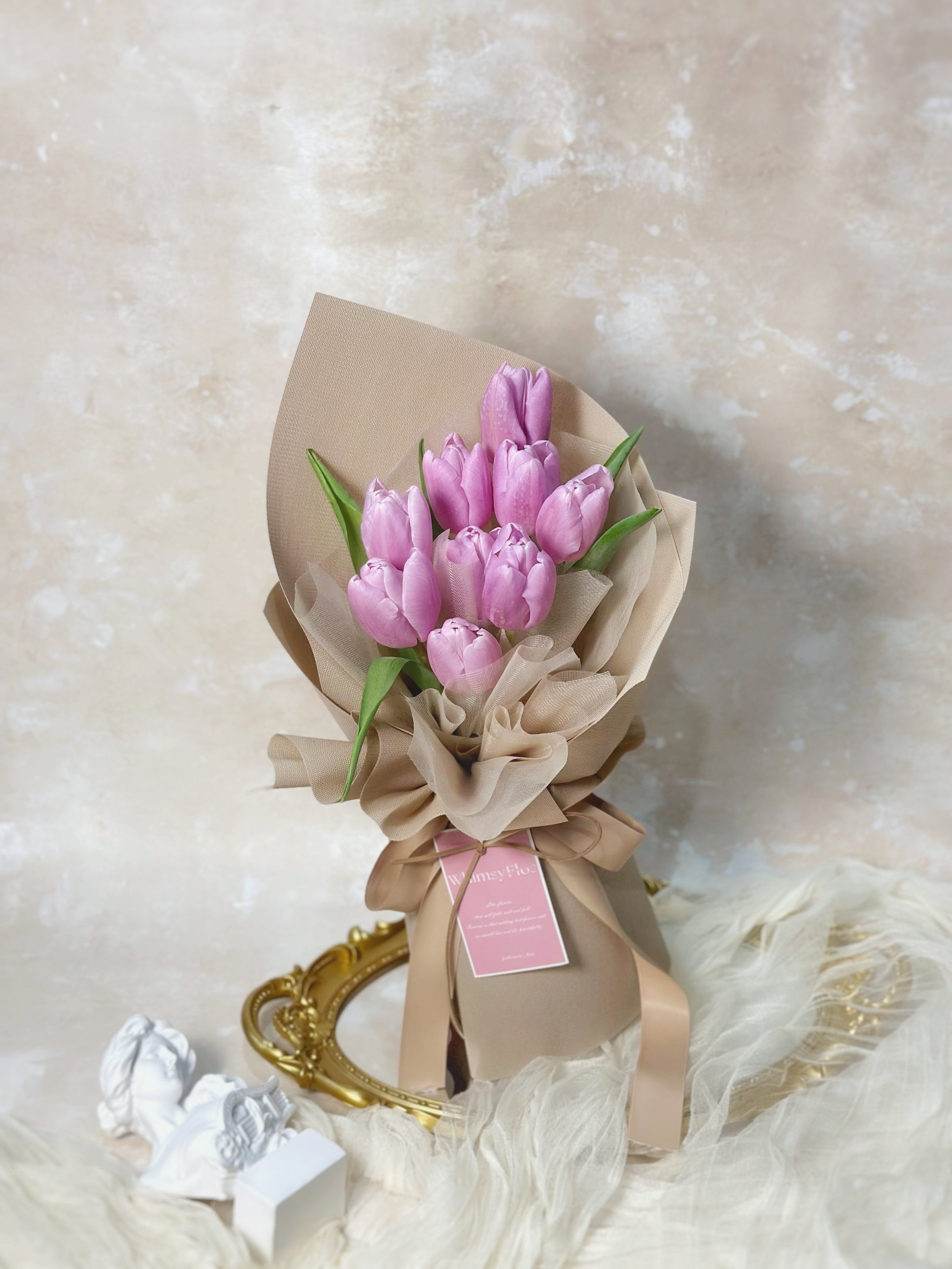 Front view of lilac tulips bouquet