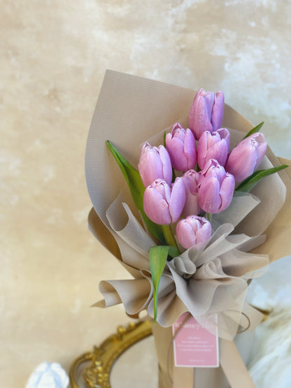 close up view of lilac tulips bouquet