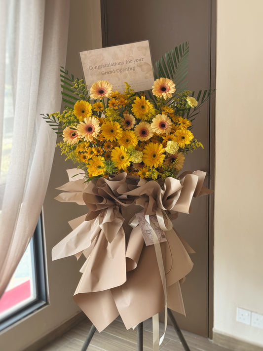 Yellow and cream daisy flower stand for grand opening celebration