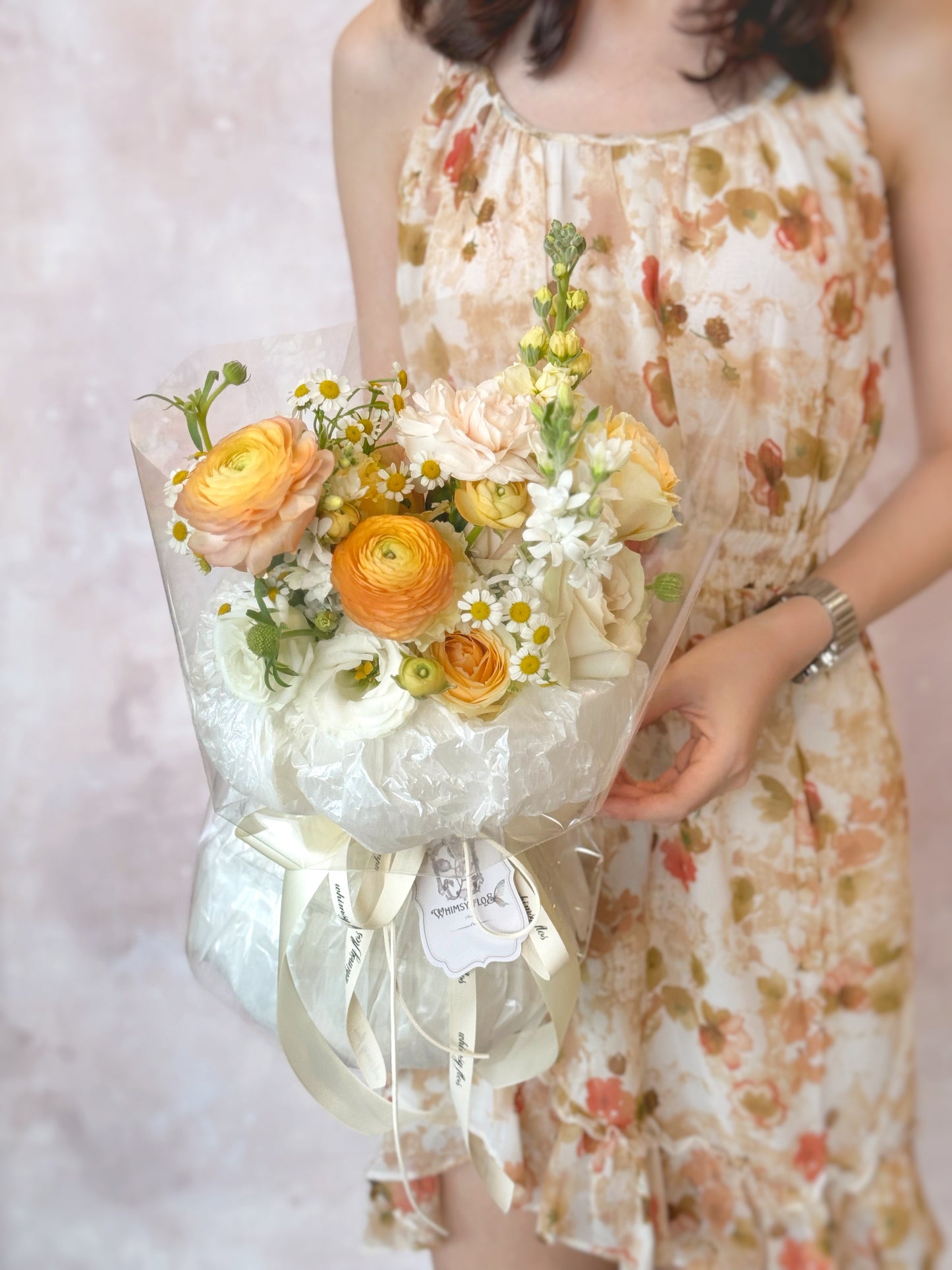 Jeanna fresh flowers handtied bouquet holding by model front view