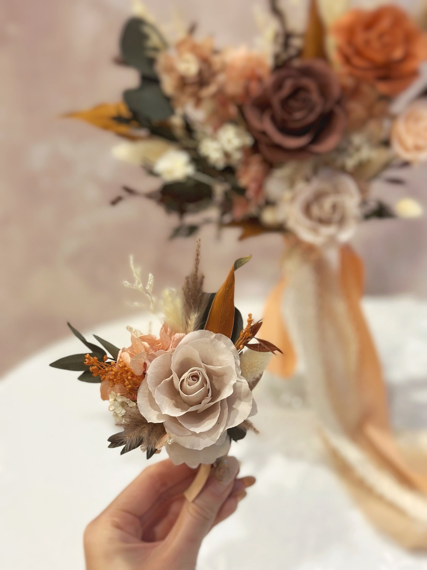 Khaki and terracotta preserved rose boutonniere, elegantly designed to complement the Katniss bridal bouquet