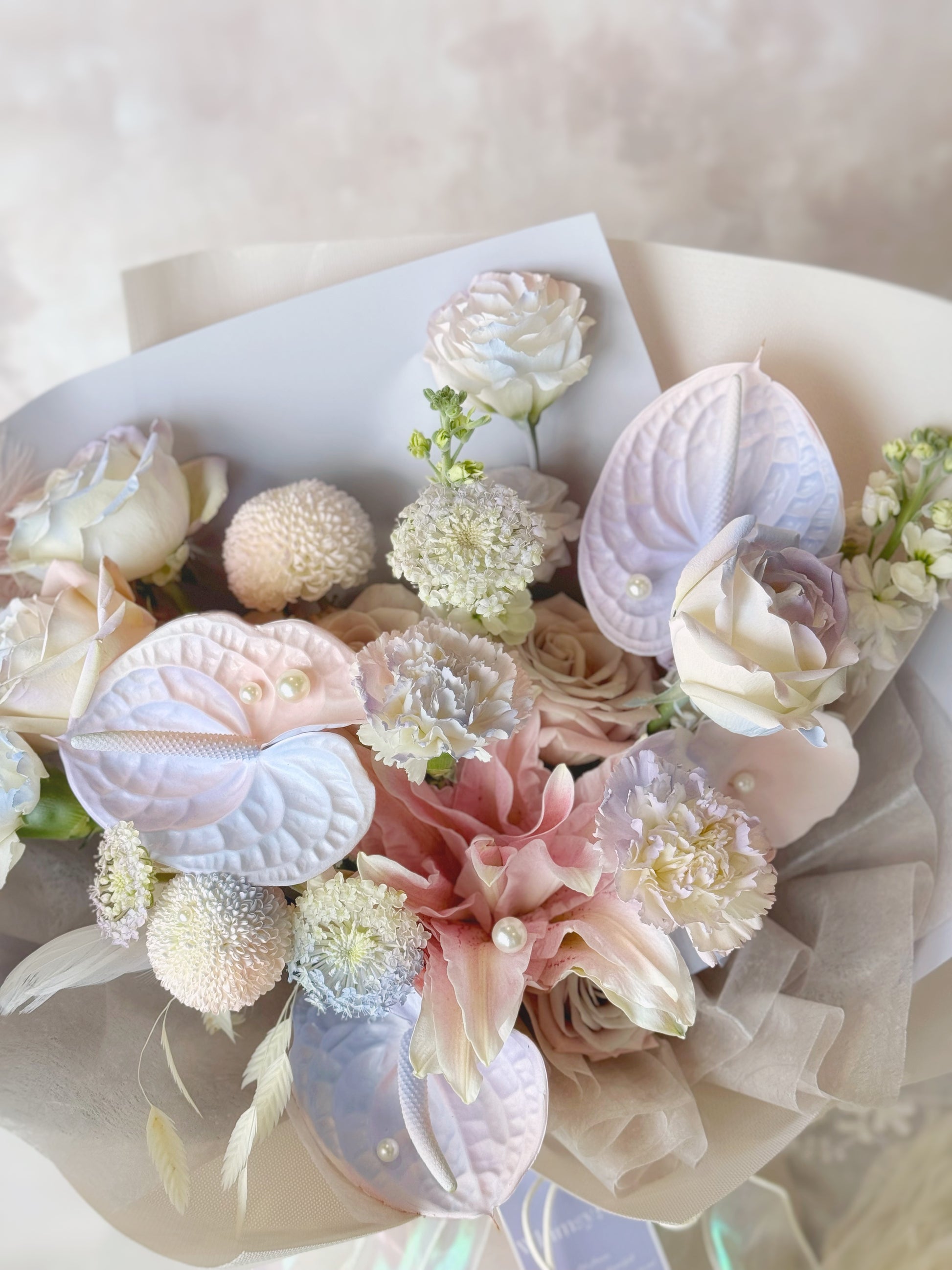 Marshmallow fresh flowers handtied bouquet close up view spray painted mixed flowers