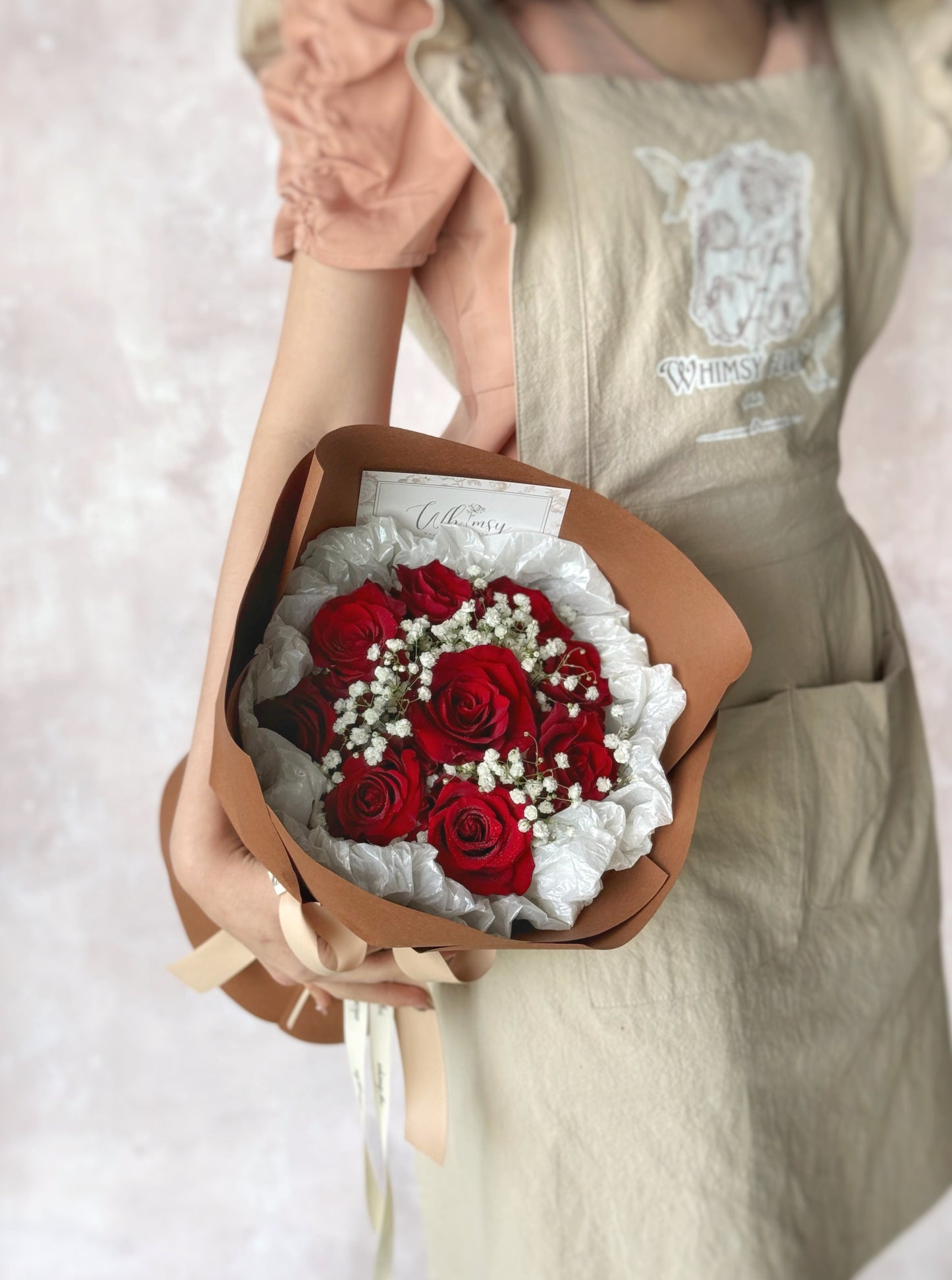 Naomi fresh flowers handtied bouquet holding by model