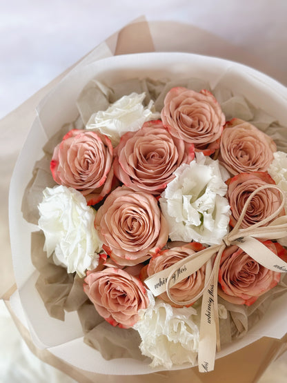 Vintage round bouquet with cappuccino roses and eustoma flowers Close up 