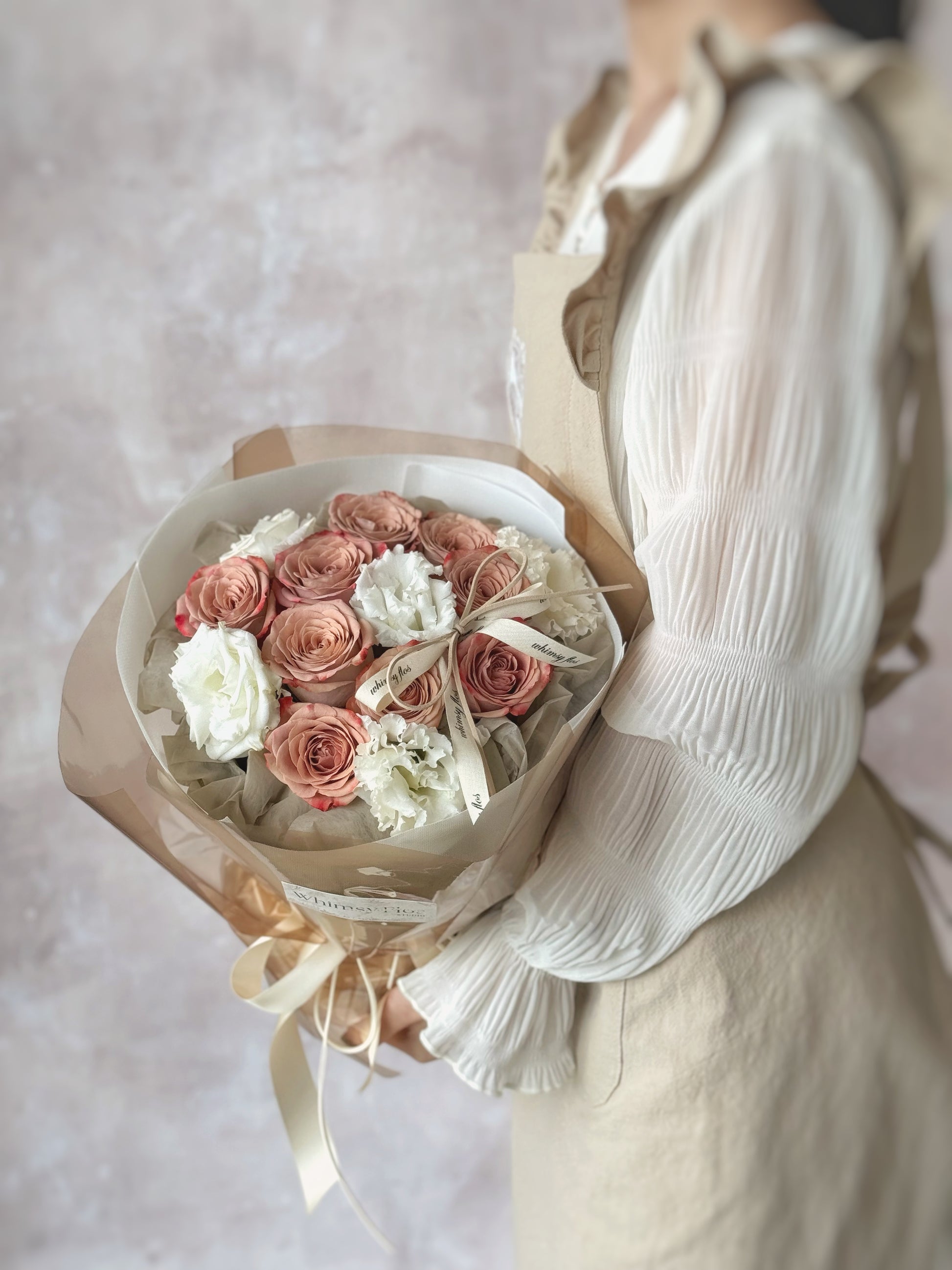 Vintage round bouquet with cappuccino roses and eustoma flowers Side view 