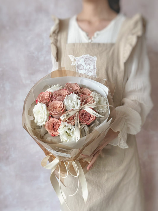 Vintage round bouquet with cappuccino roses and eustoma flowers 