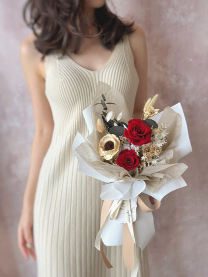 Promise preserved flowers bouquet luxe size holding by model