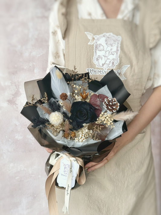 Rust Et Noir preserved flowers bouquet holding the bouquet