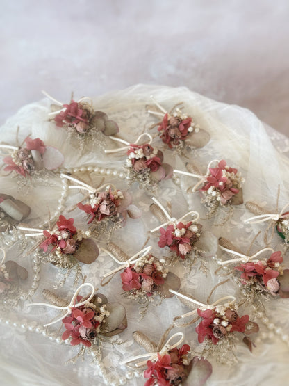 Rustique Rose tinted preserved and dried flowers boutonniere on the table
