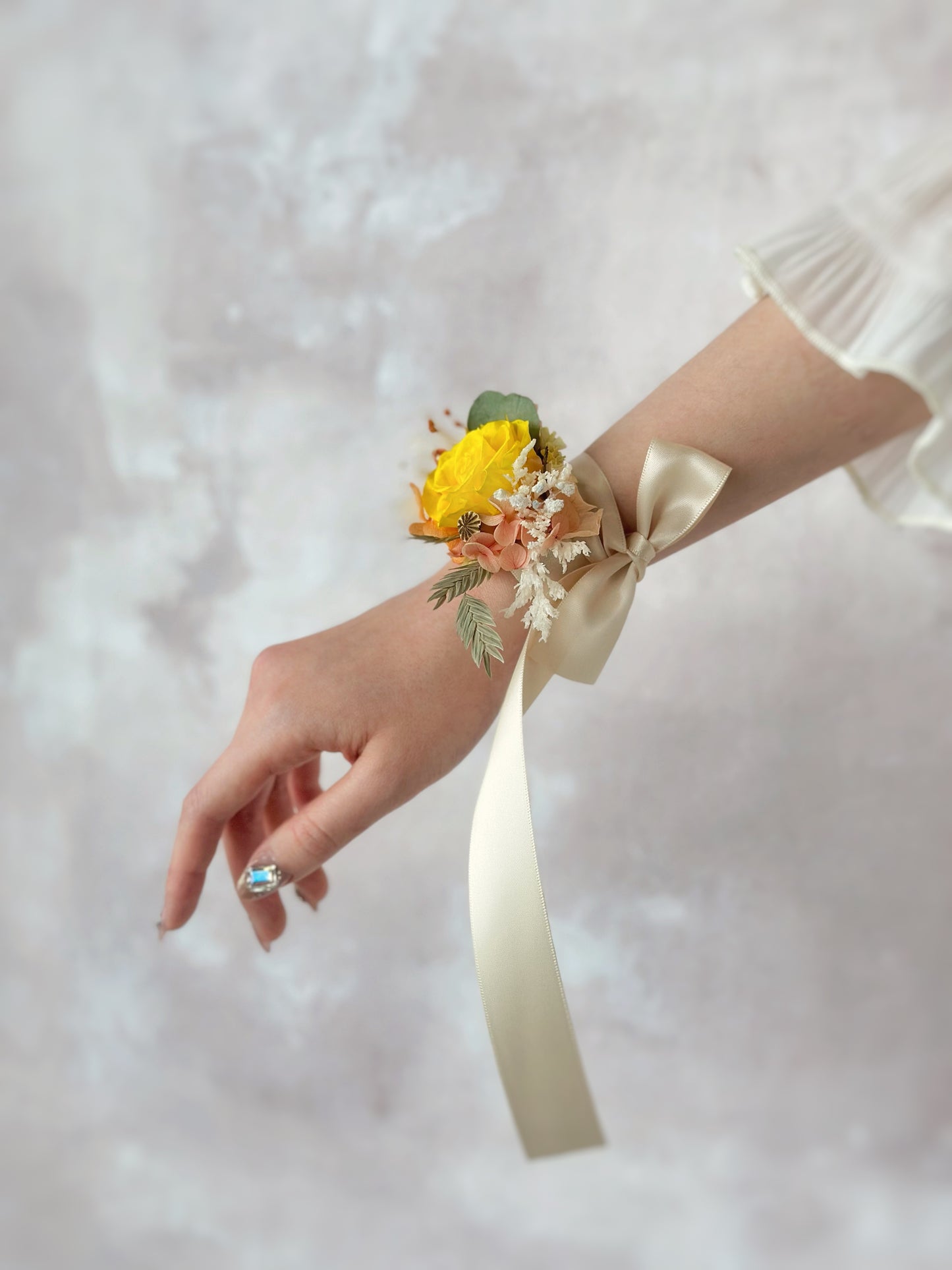 Side view of how a preserved flowers wrist corsage looks like