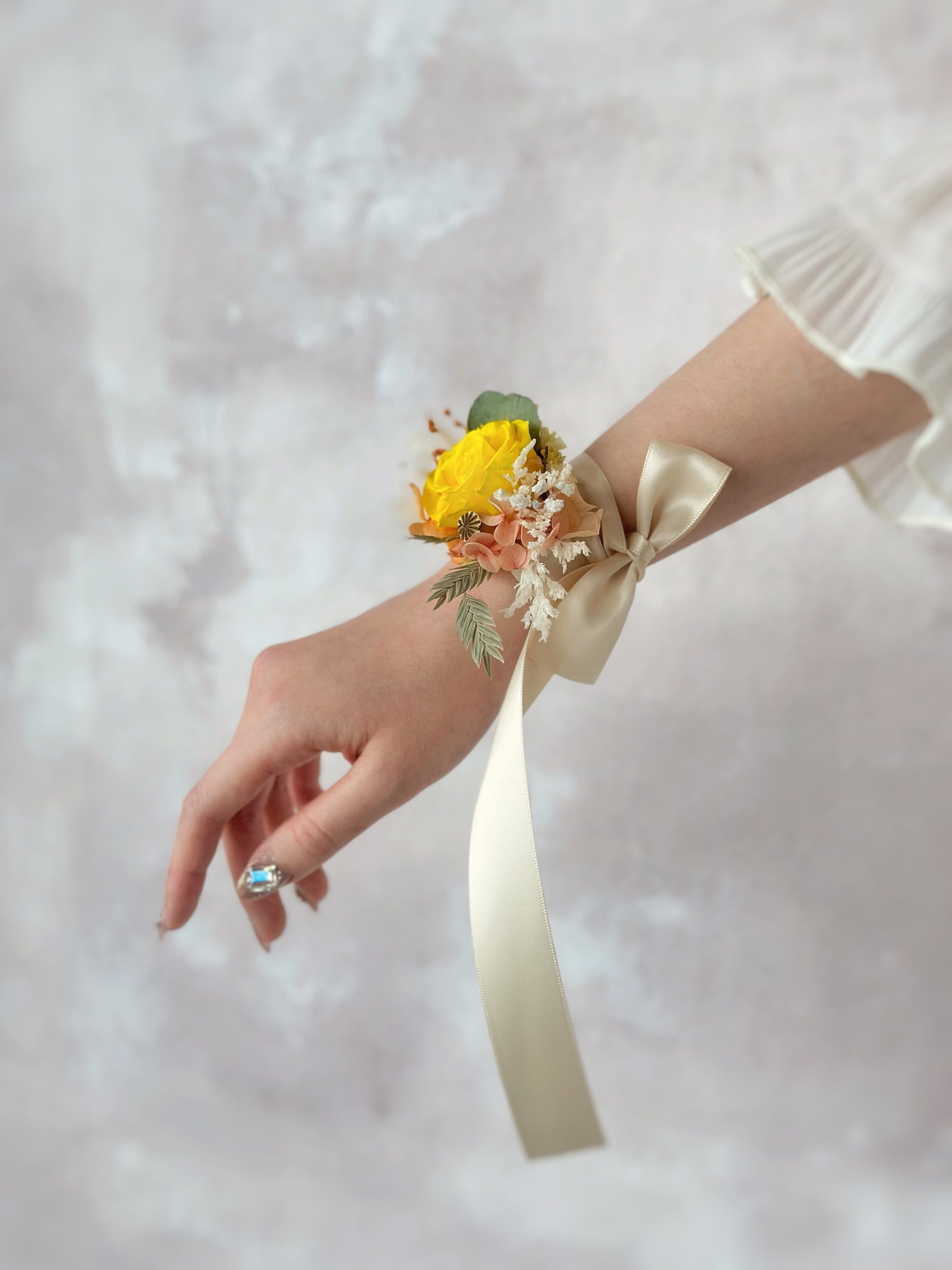 Side view of how a preserved flowers wrist corsage looks like