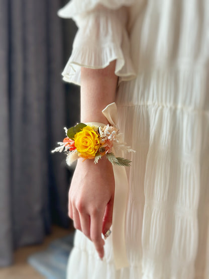 Close up view on how to wear a wrist corsage.