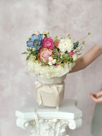 weekly flowers round bouquet in pink wrapping with garden style floral arrangement, front view